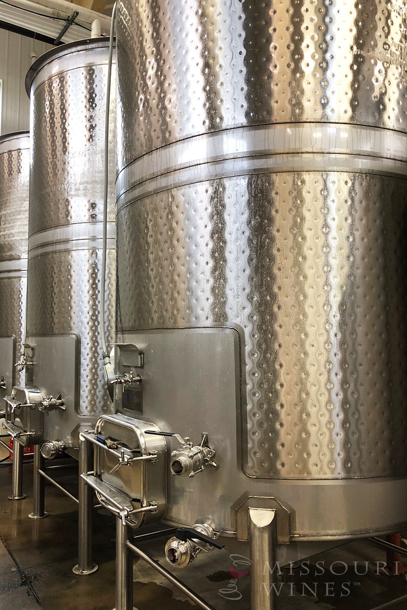 Winter Winemaking in Missouri | A row of tanks hold in-process wines.