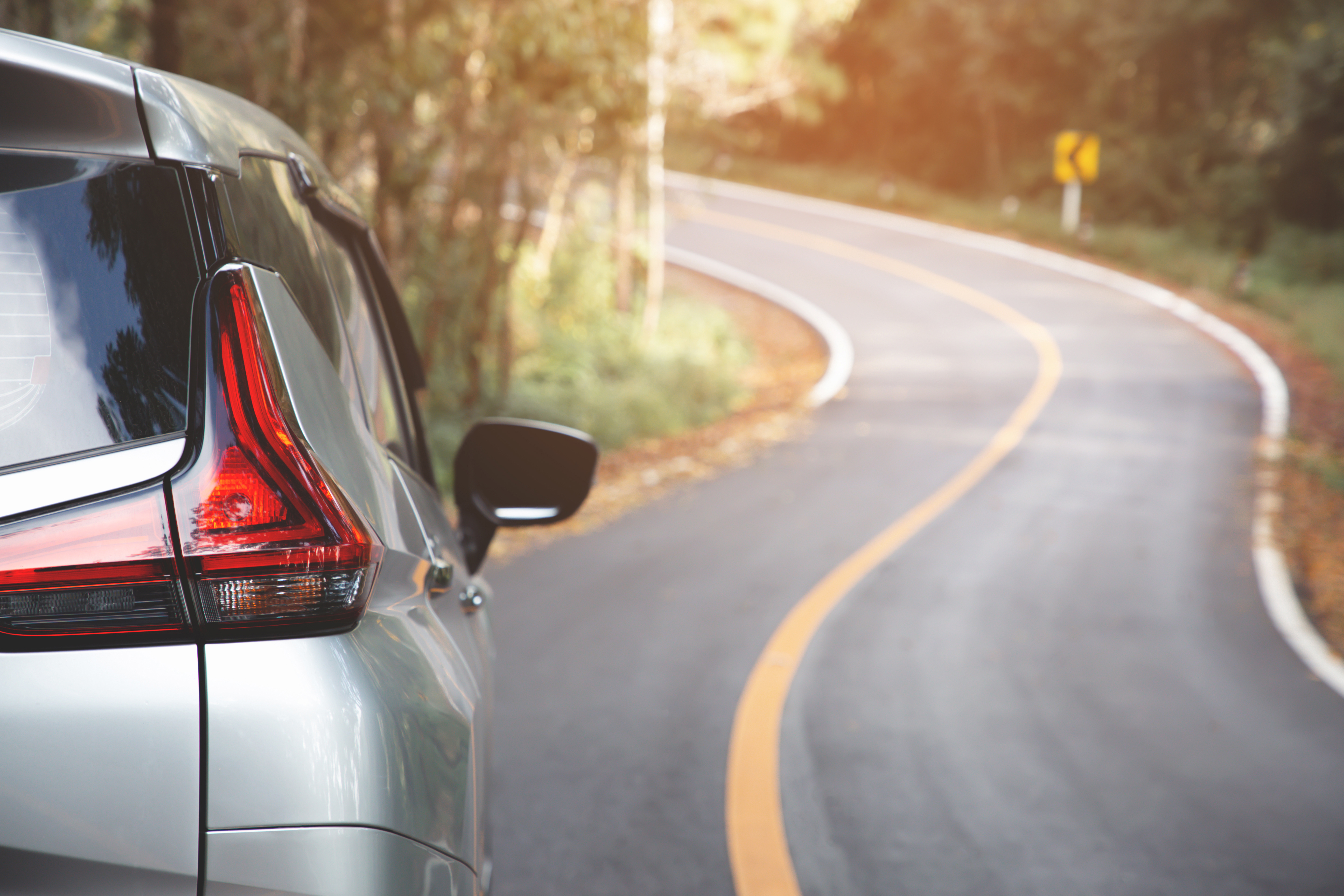 Car driving down road