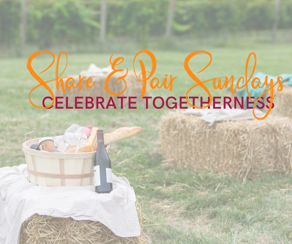 Text overlayed an image with a strawbale in the front with a basket of food items and wine. 