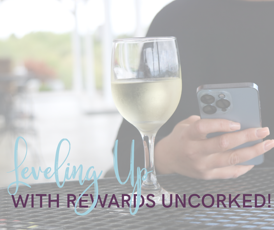 wine glass sitting on a table with someone on their phone with text overlayed.