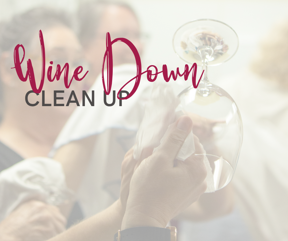hands polishing a glass with words over the top reading wine down clean up