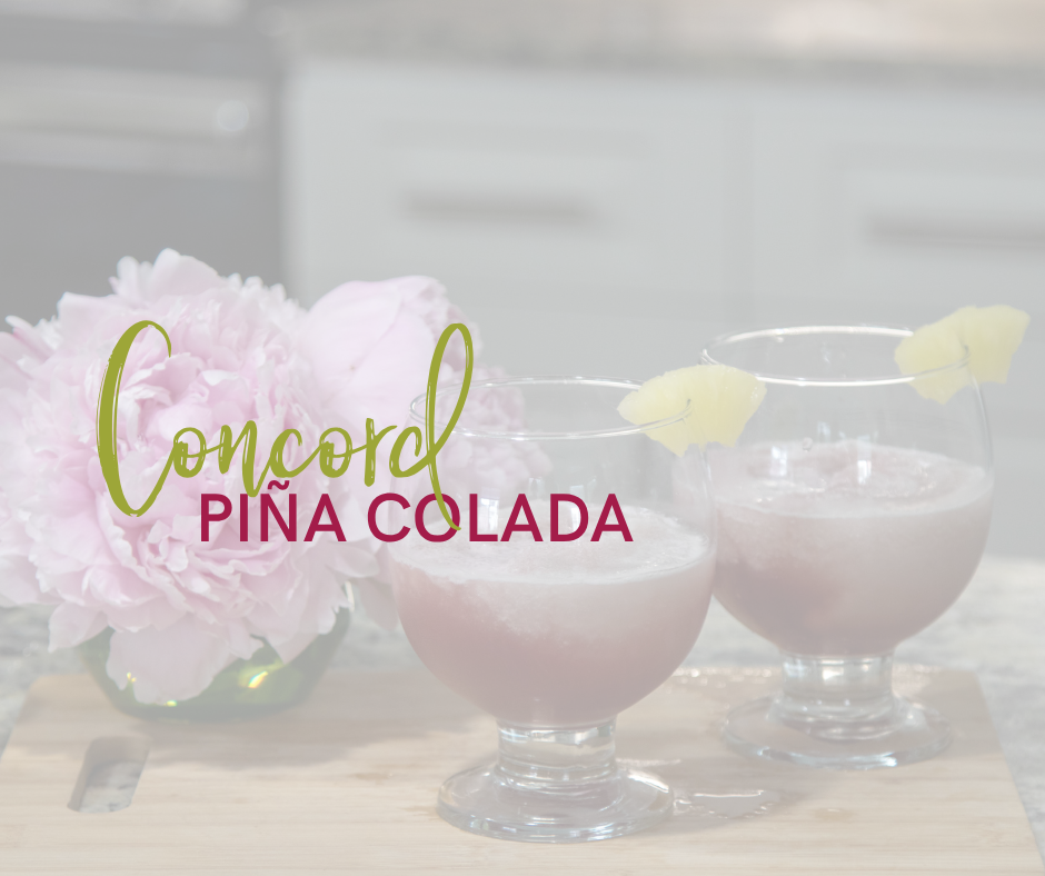 2 glasses of concord pina colada with flowers sitting on a cutting board with the words concord pina colada on the top 