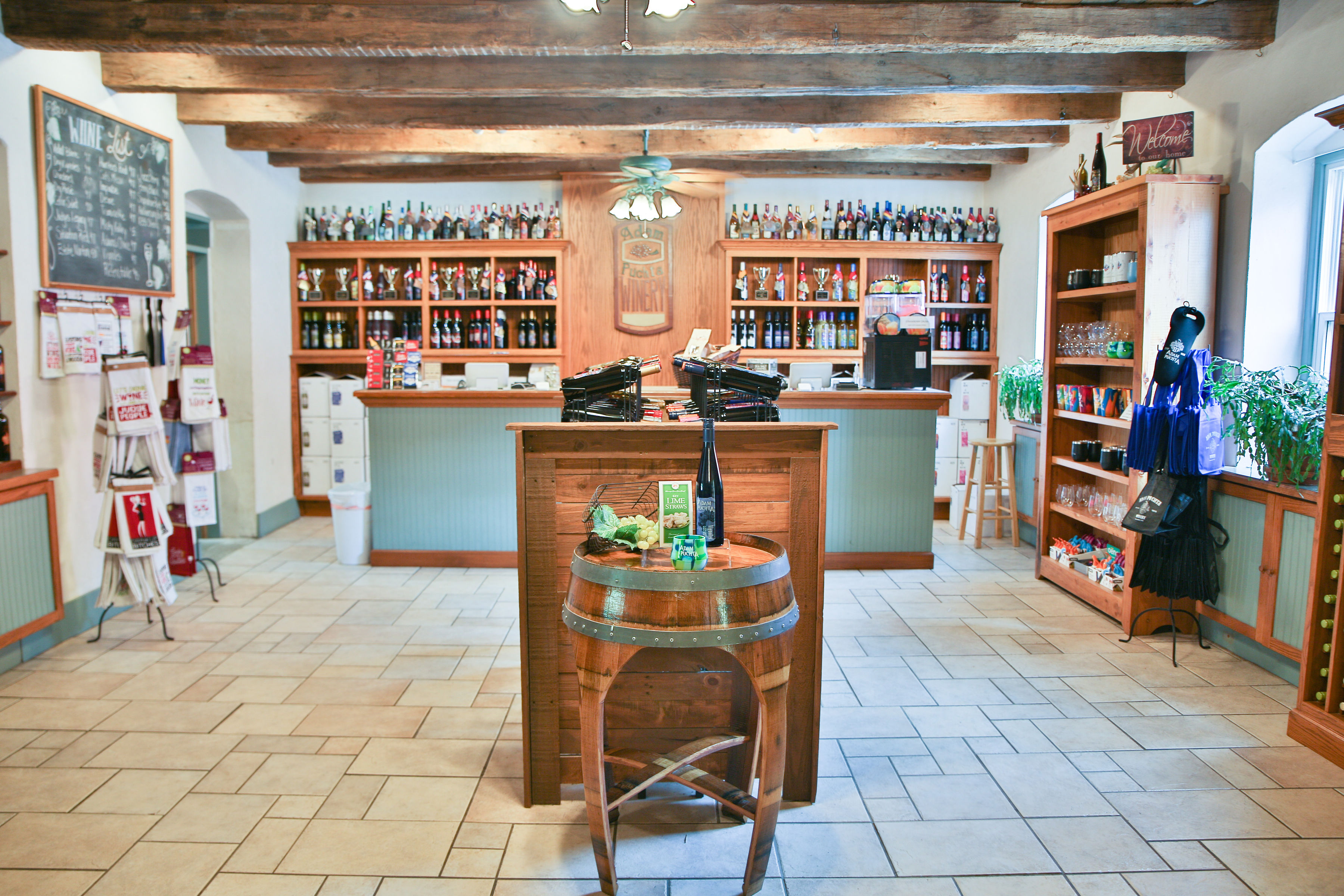 Adam Puchta Winery- A gift shop with a wall of wine on the back wall.