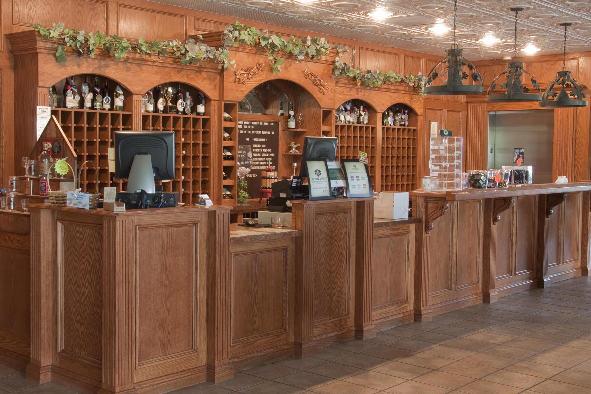 Crown Valley Winery- Front desk of the winery. Two computers on a large wooden desk.