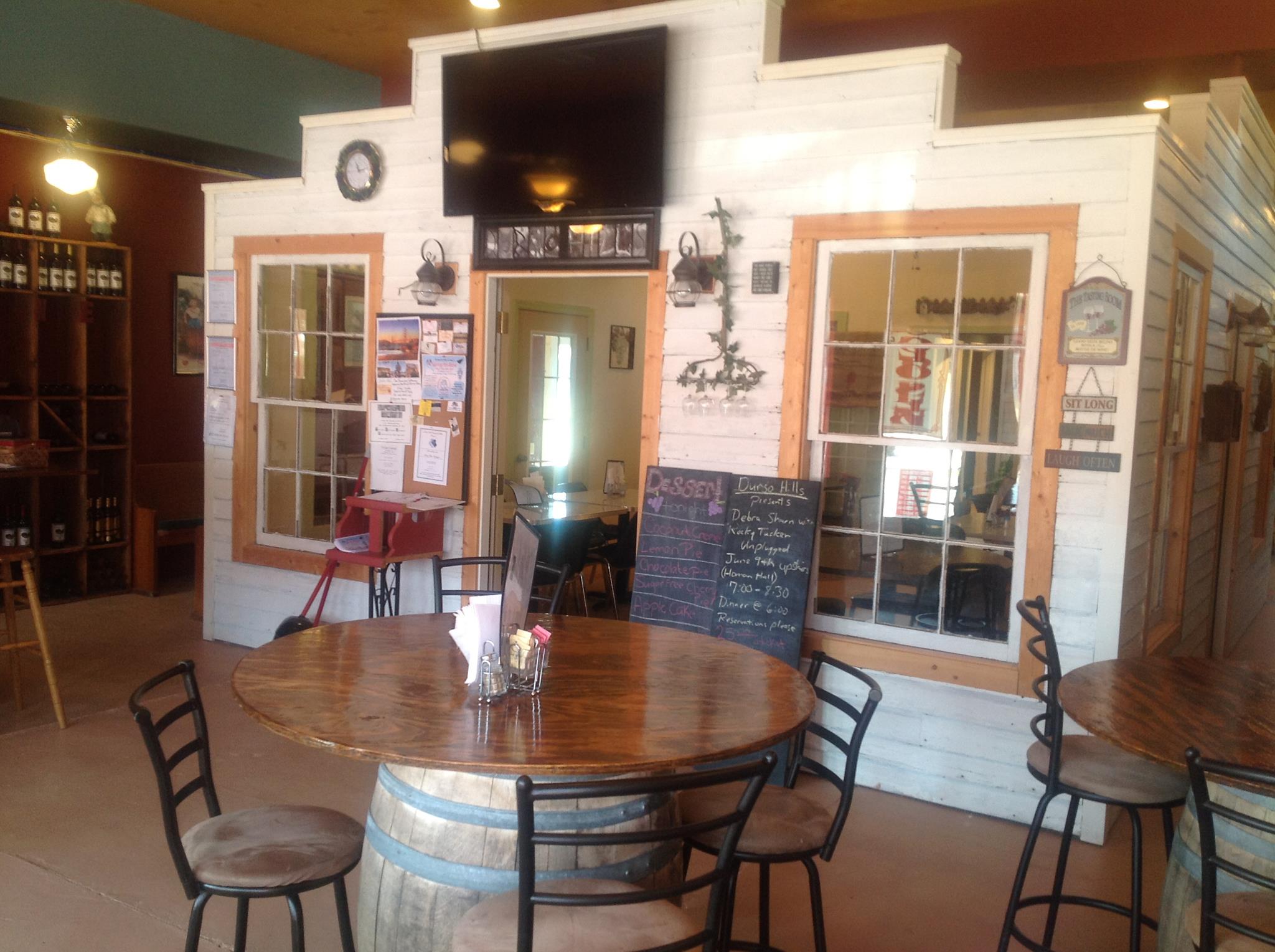 Durso Hills Winery and Bistro- A seating area with a mock store front in the middle.