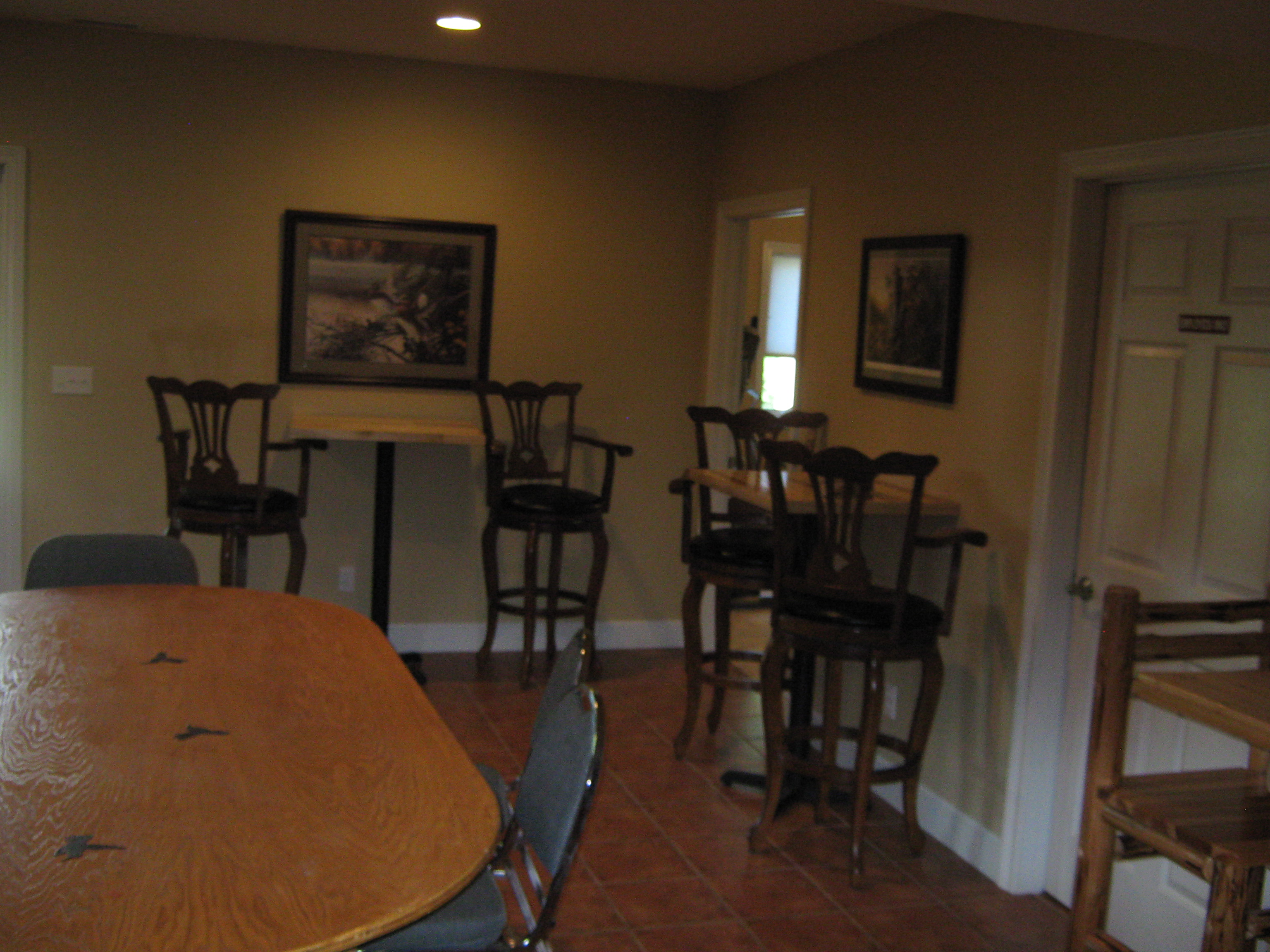 Hummingbird Vineyard and Winery- Indoor seating. Several bar height tables and chairs.