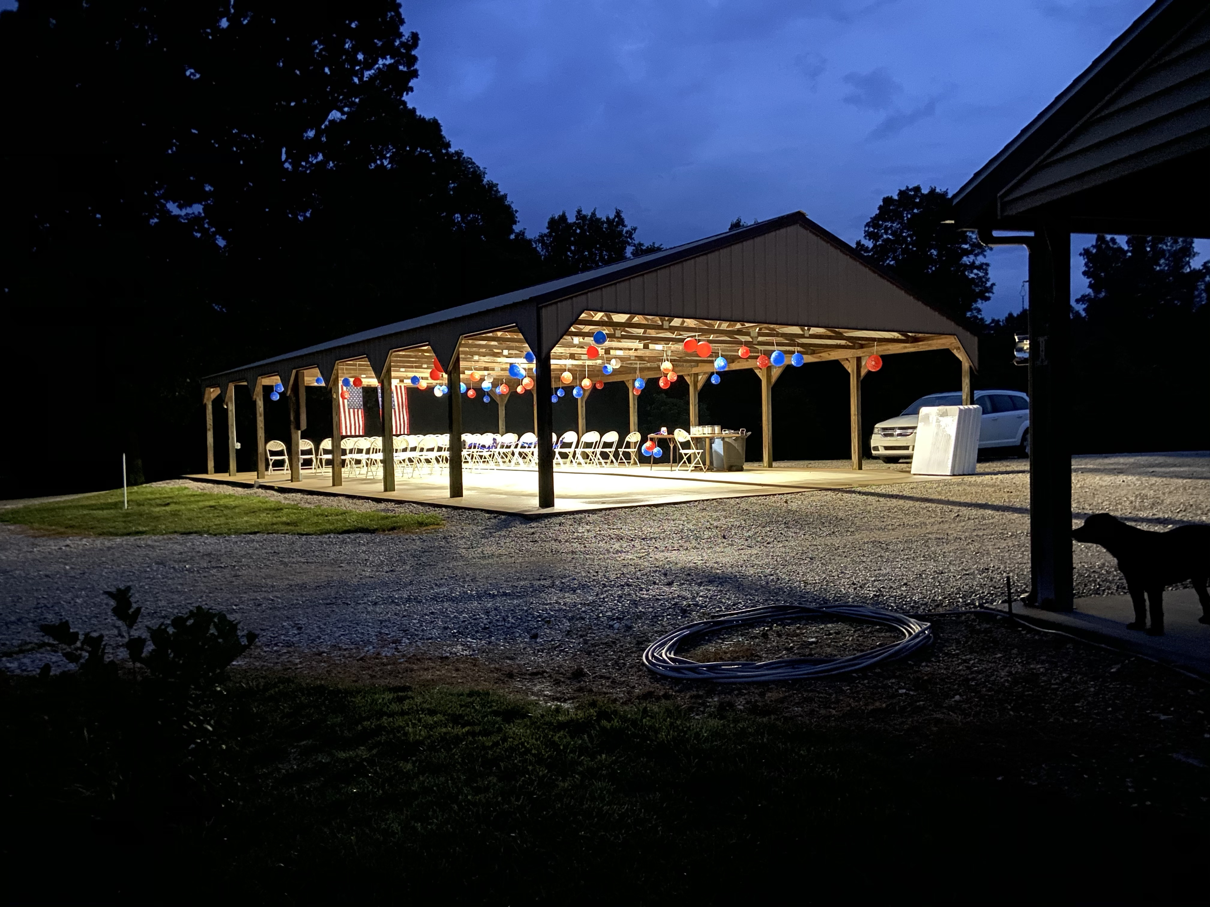 Twains Vineyard - outdoor photo, nighttime, of a large pavilion with lights and decorations.