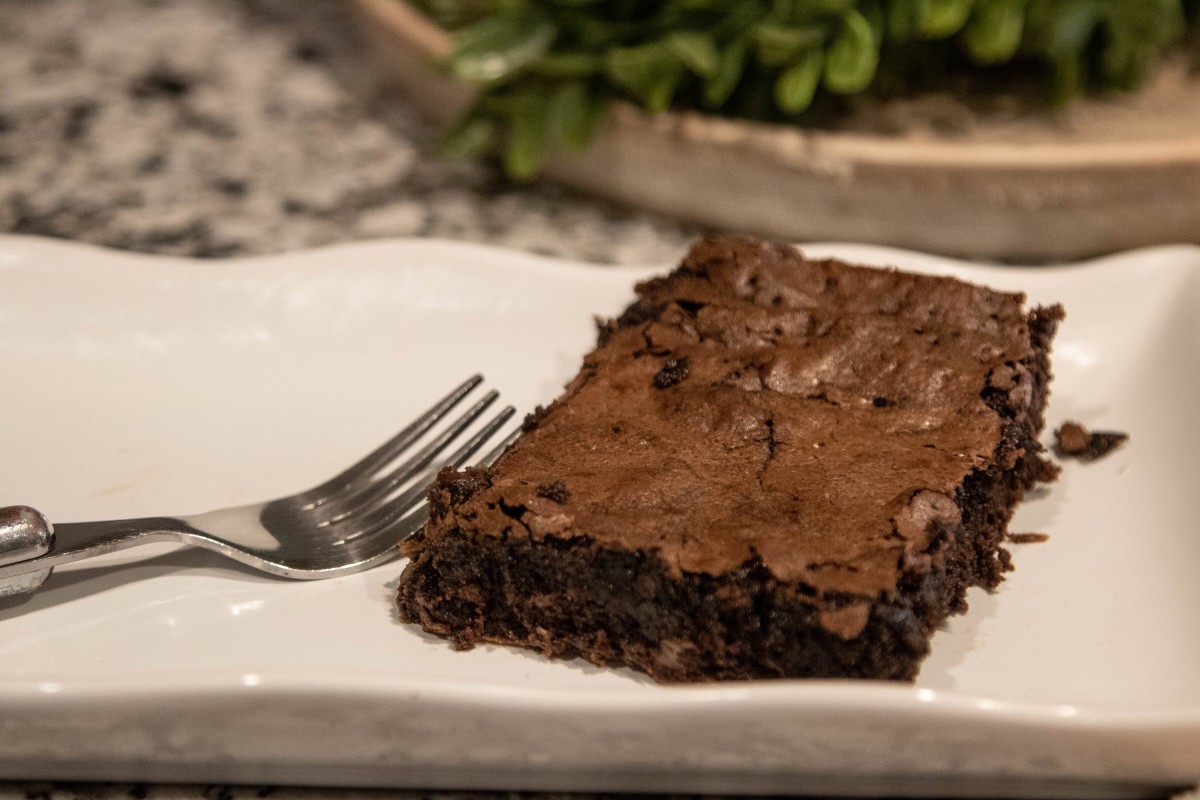Deep-dish fudgy port brownie on plate with fork