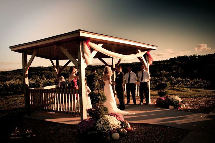 Seven Springs Winery - outdoor photo, daytime, of a wooden gazebo during a wedding ceremony.