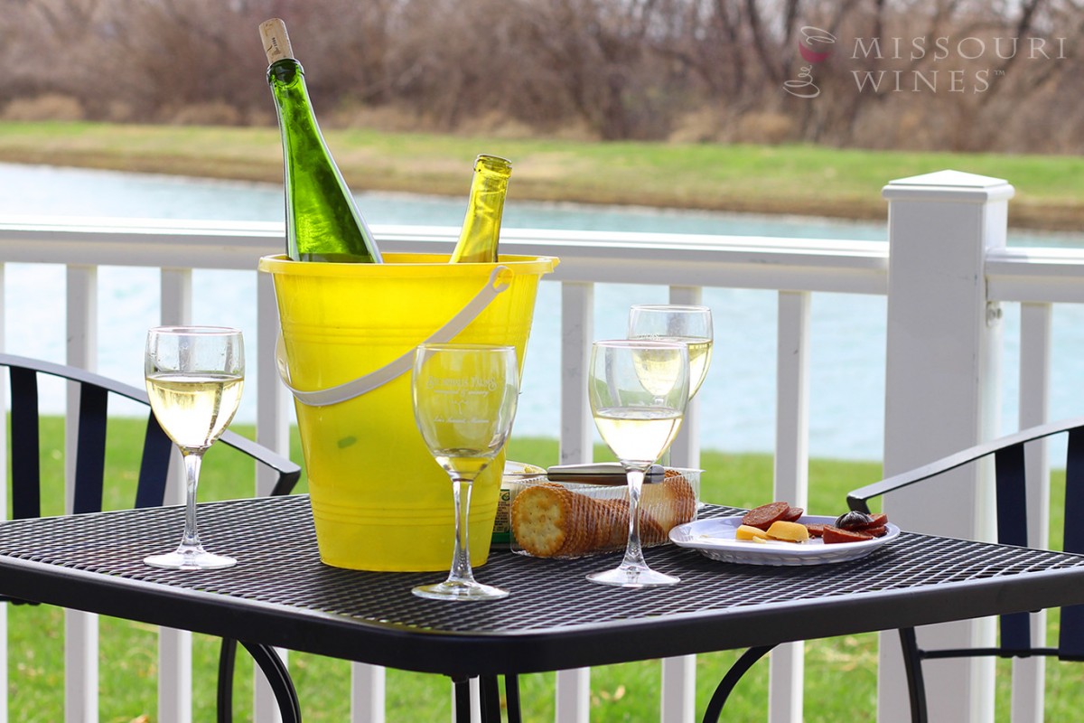 Spotlight on Missouri Wine Country: KC Area | Stonehaus Farms Vineyard & Winery has a lovely patio overlooking a lake where you can enjoy award-winning Missouri wine.