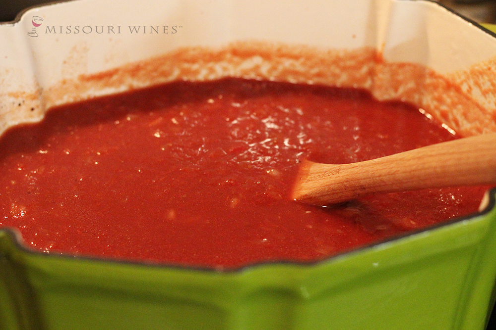 Tomato soup recipe made with Missouri Norton wine simmering on the stove. 