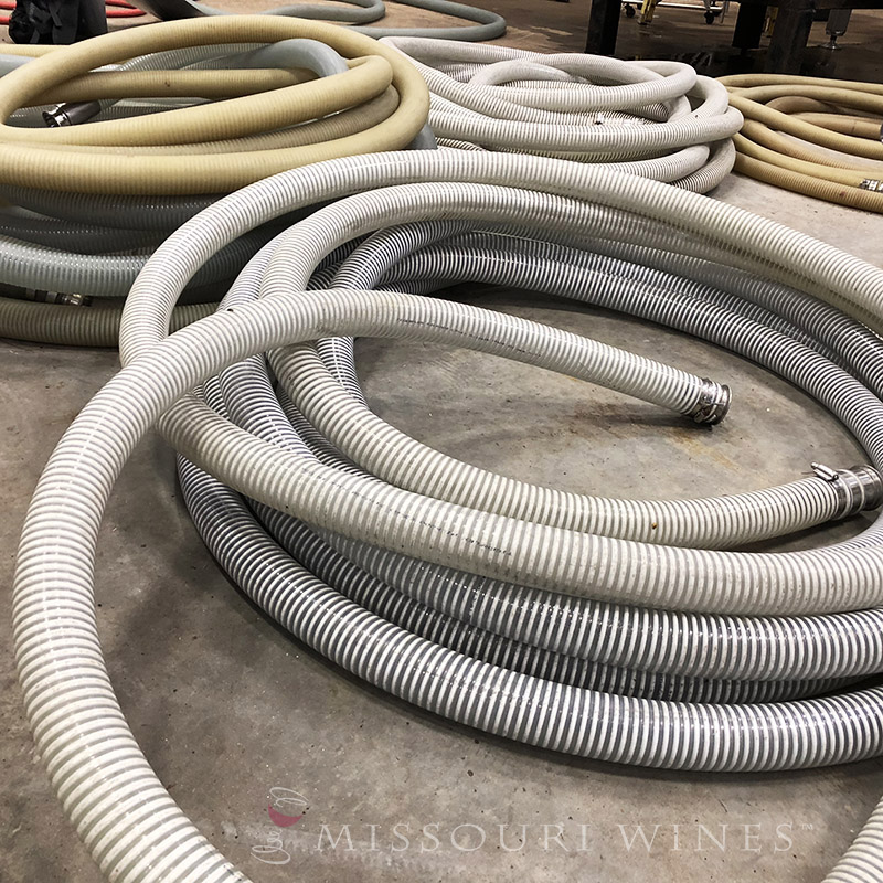 Winter Winemaking in Missouri | Behind the scenes at a winery hoses are rolled and ready for when filtration starts.