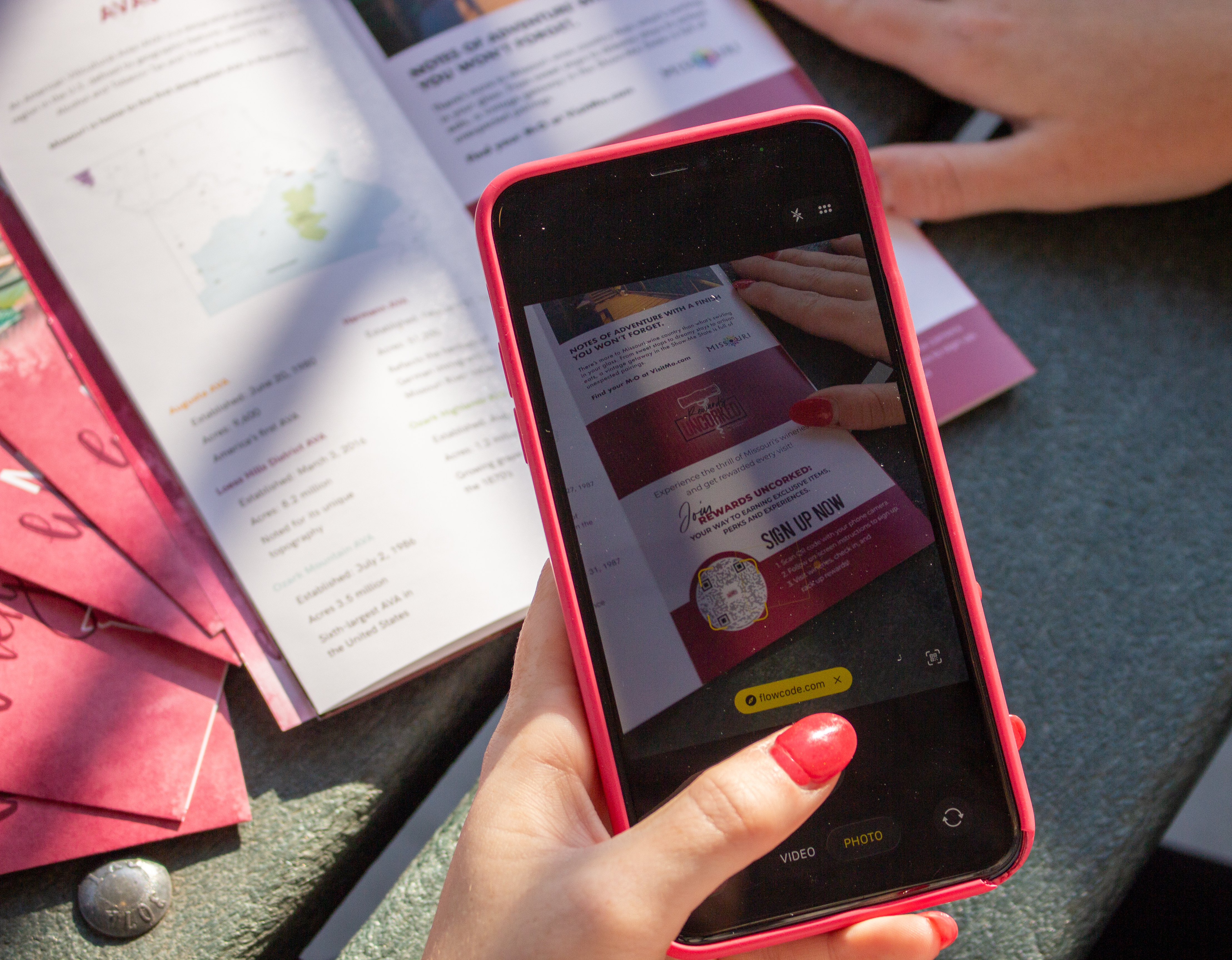 a phone scanning the rewards uncorked qr code