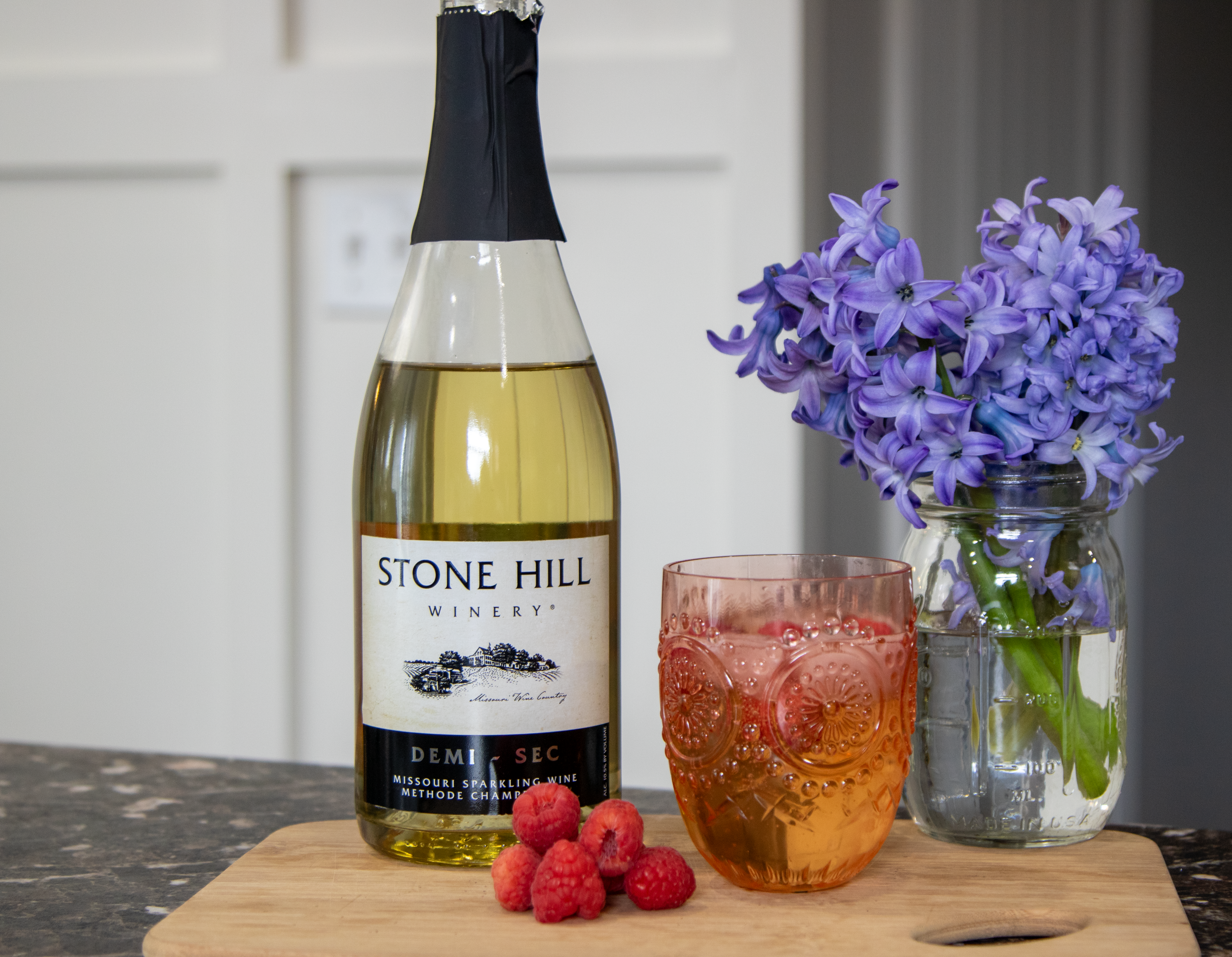 Finished Cordial Spritz with flowers, raspberries, and wine