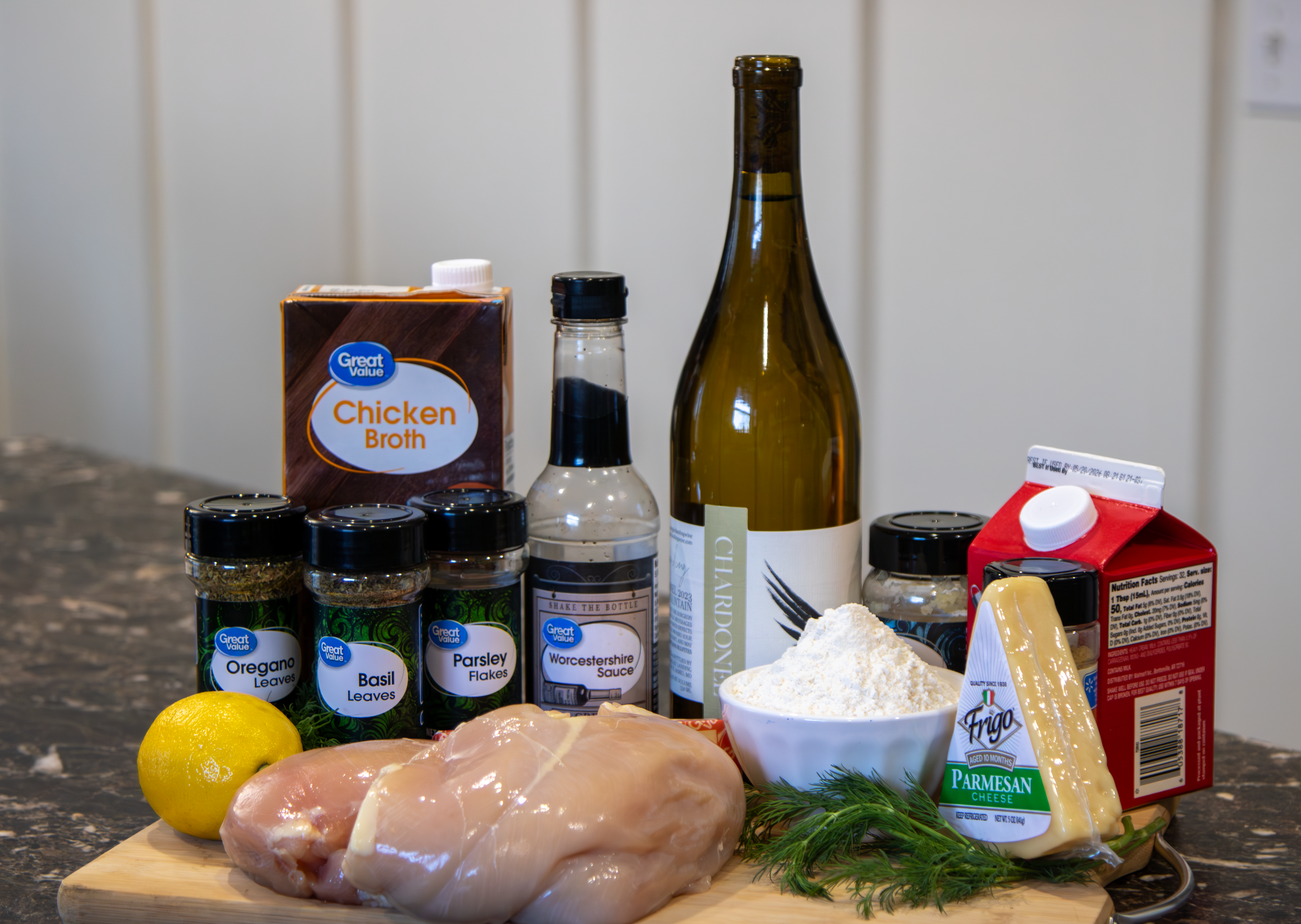 Creamy Chardonel Chicken ingredients on cutting board.