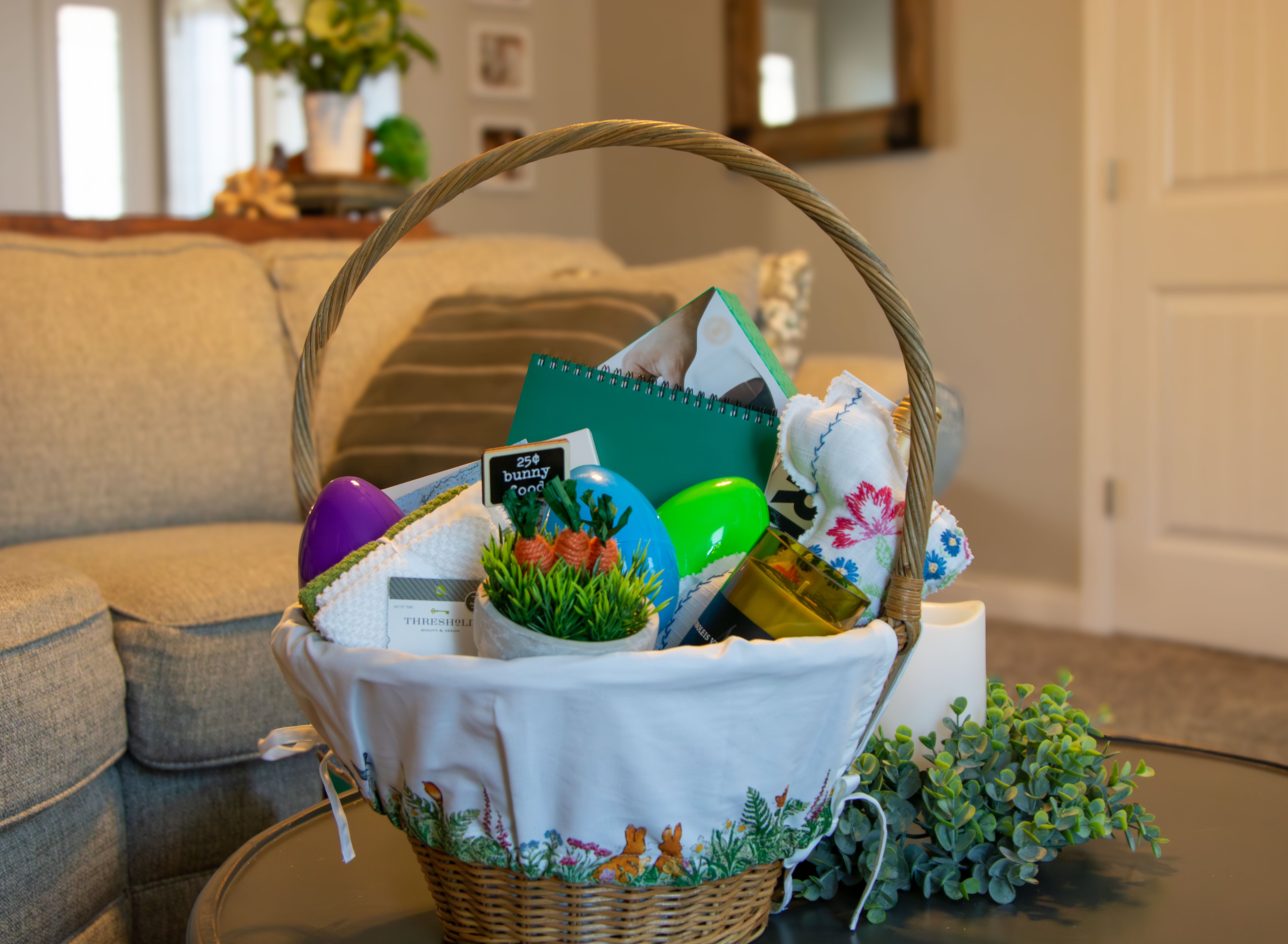 Easter Basket full of goodies sitting on a coffee table