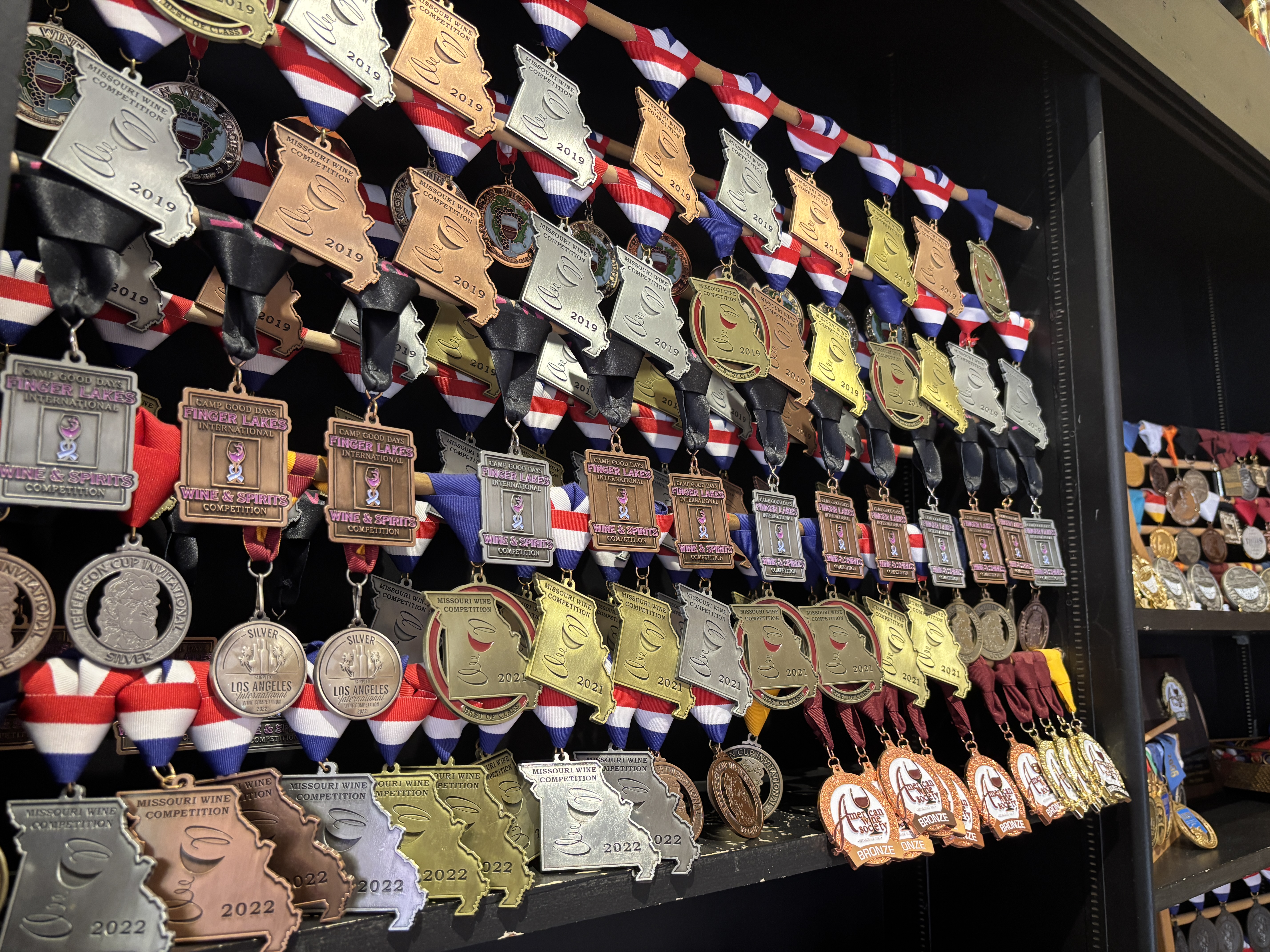 Wall full of medals that a Missouri Winery has won