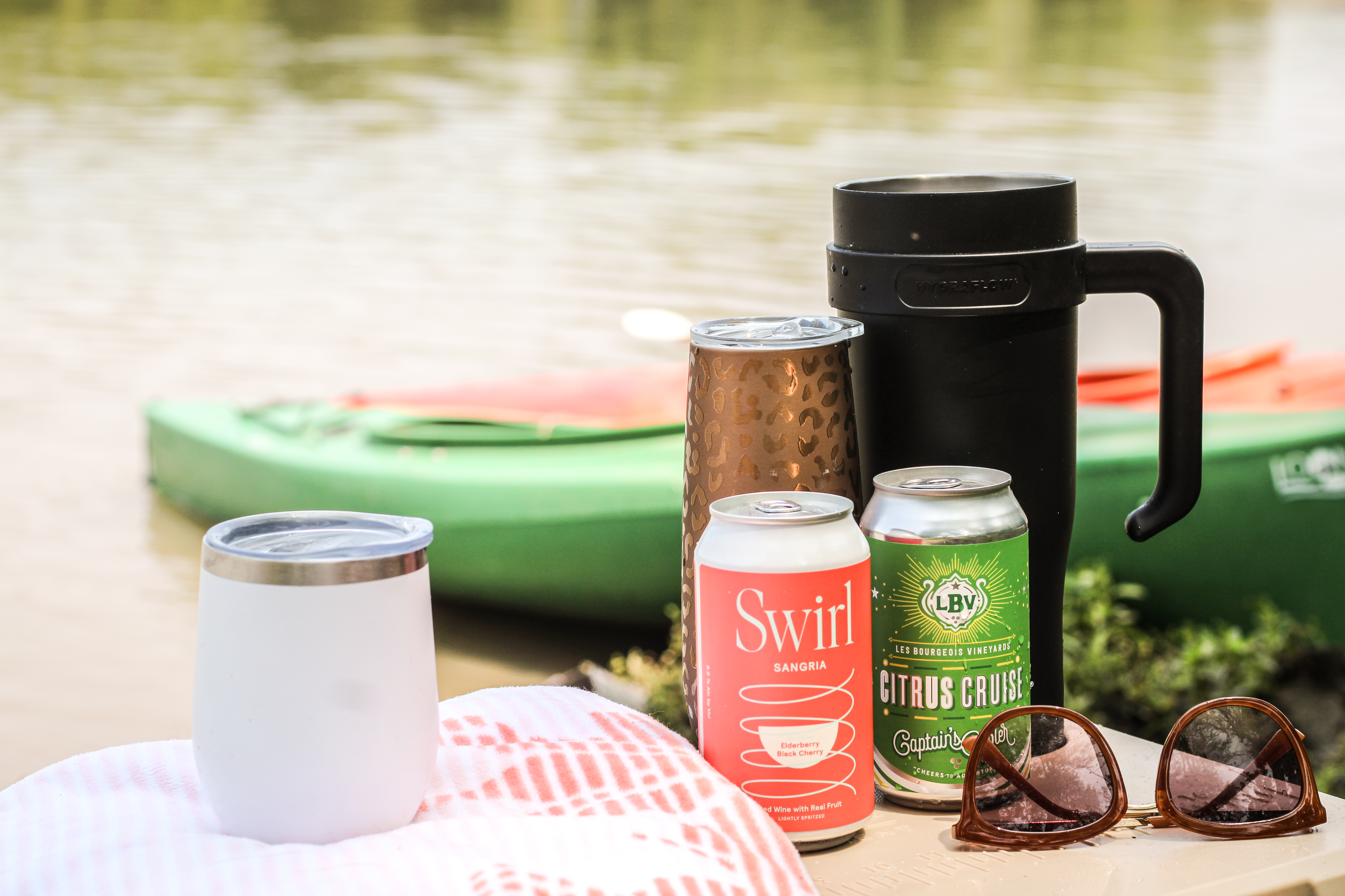 Boat with wine cans and tumblers