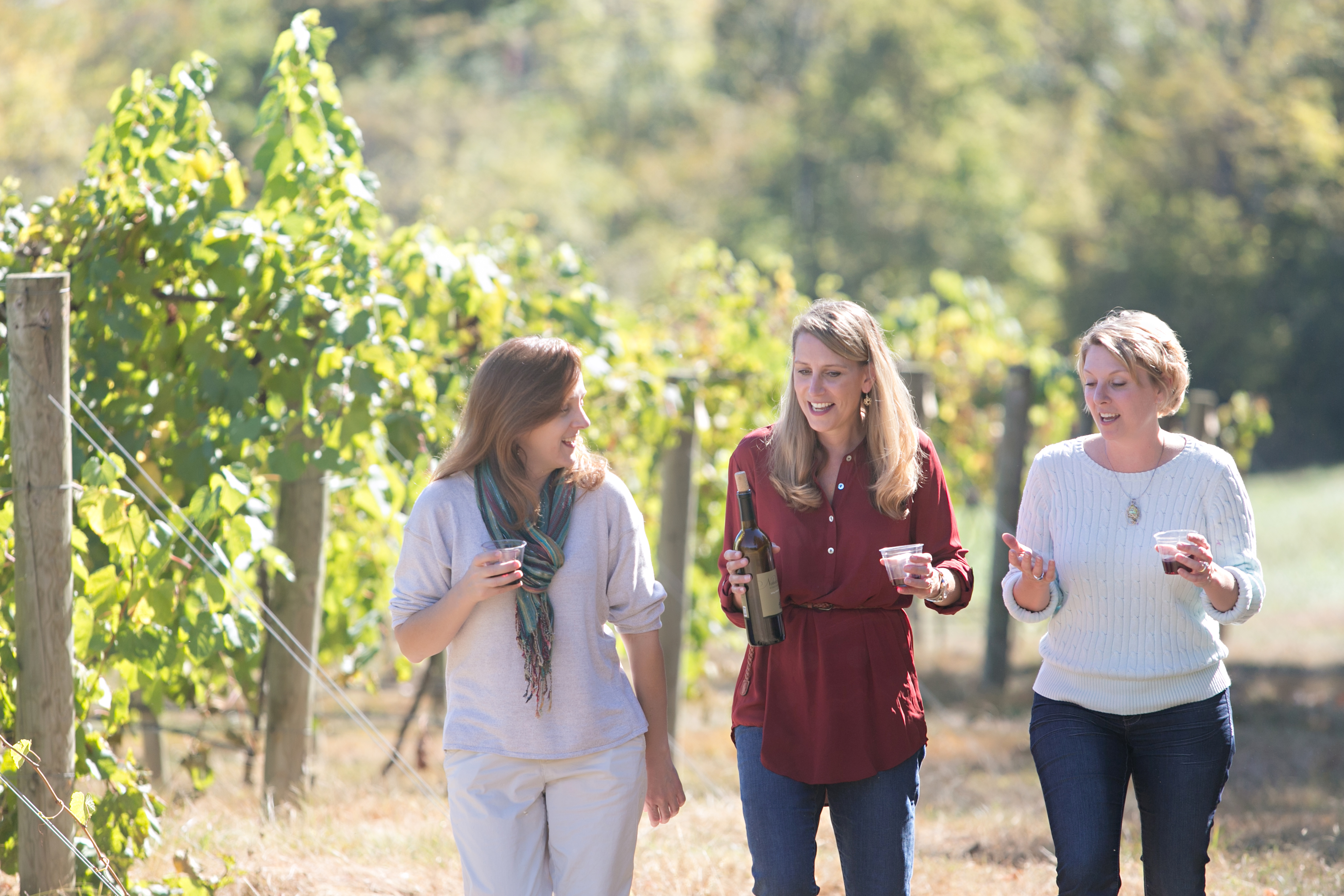 Women walking at Noboleis Vineyards.