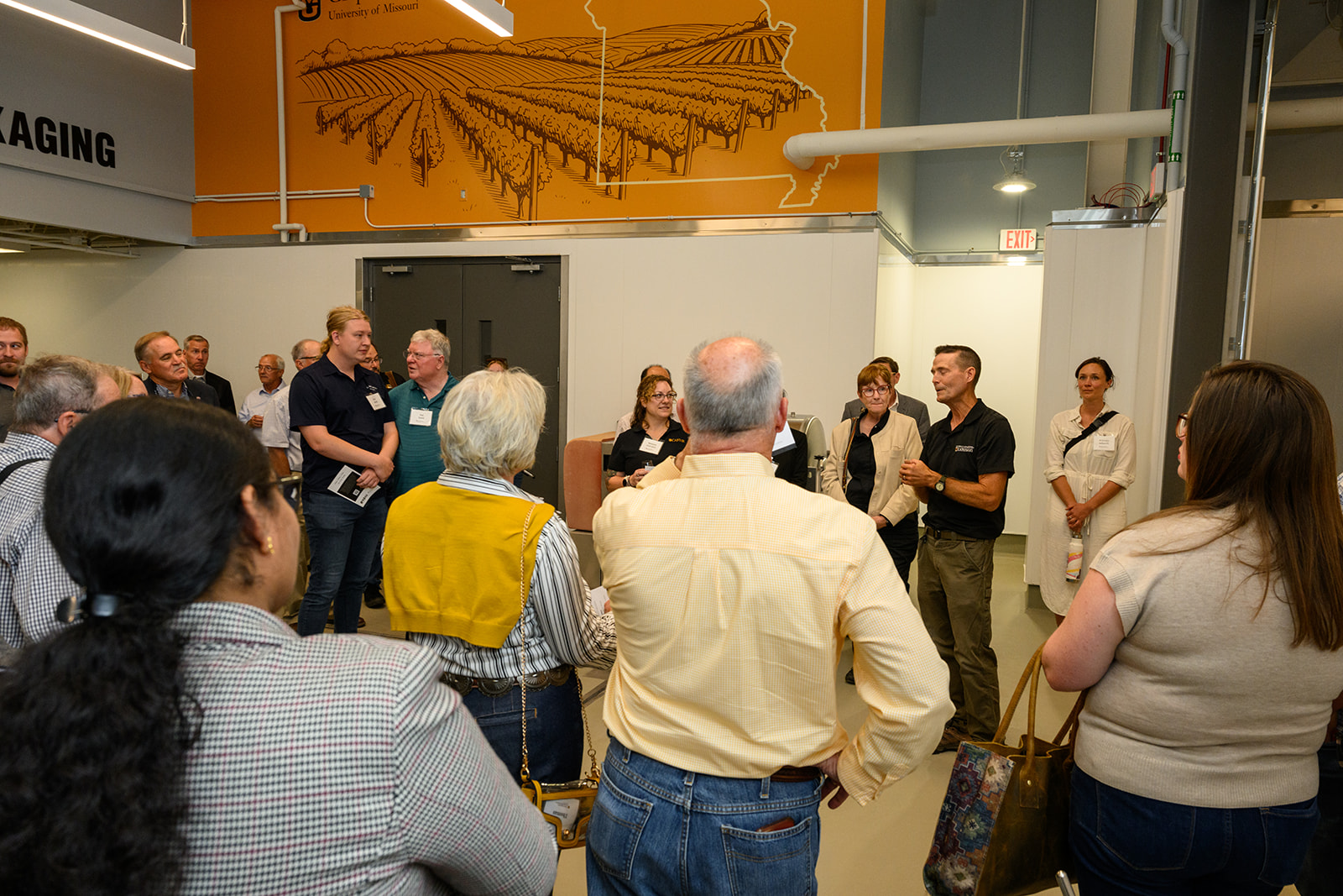 A man presenting to a group of people. 