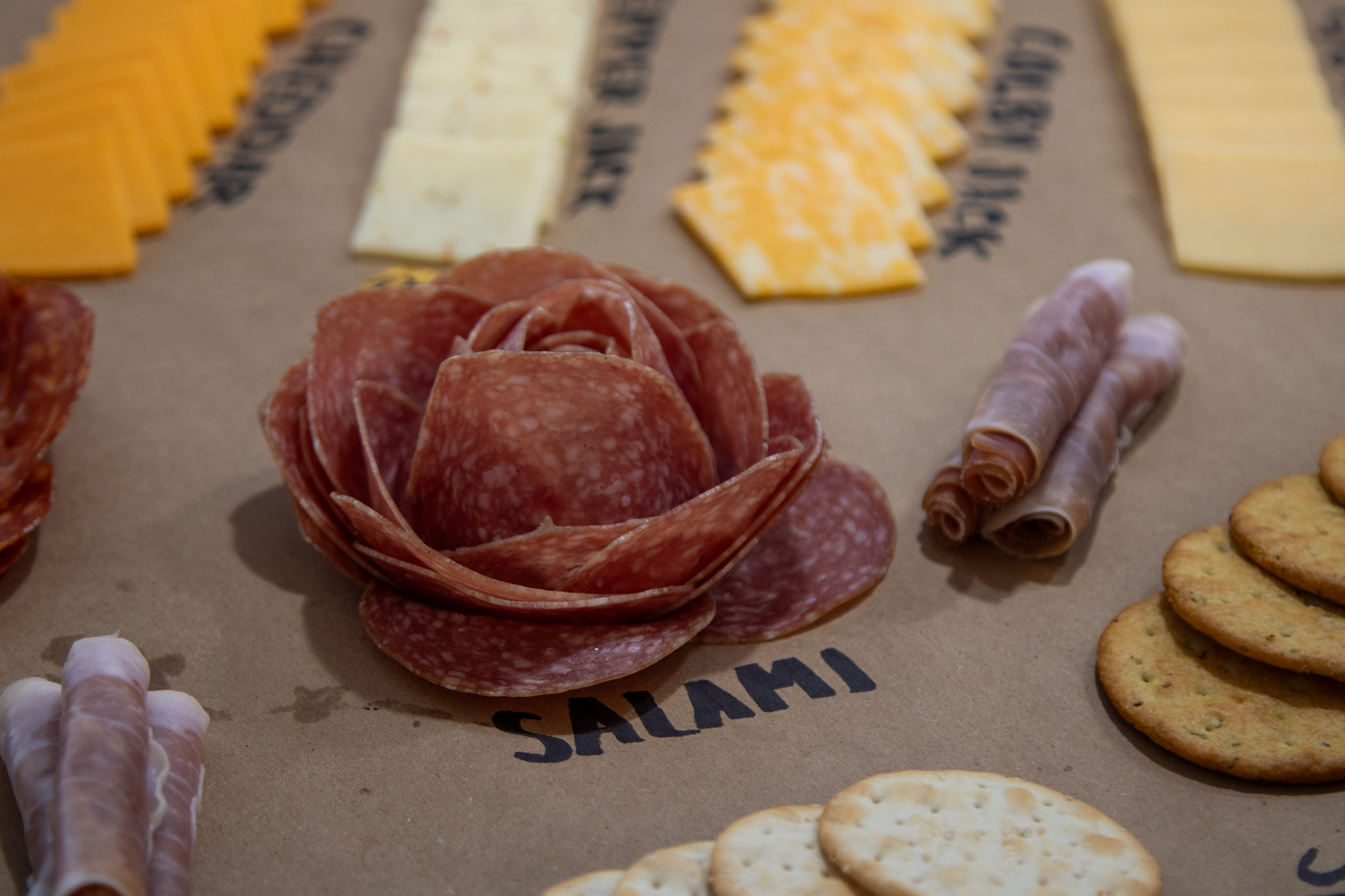 a close up shot of the salami rolled into a rose