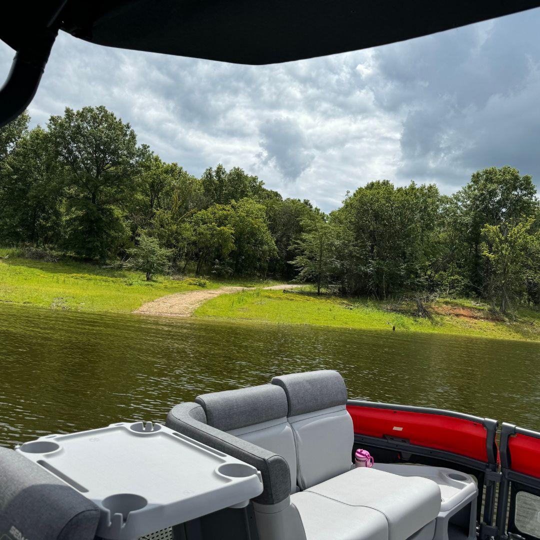 boat on the water looking at a winery trail