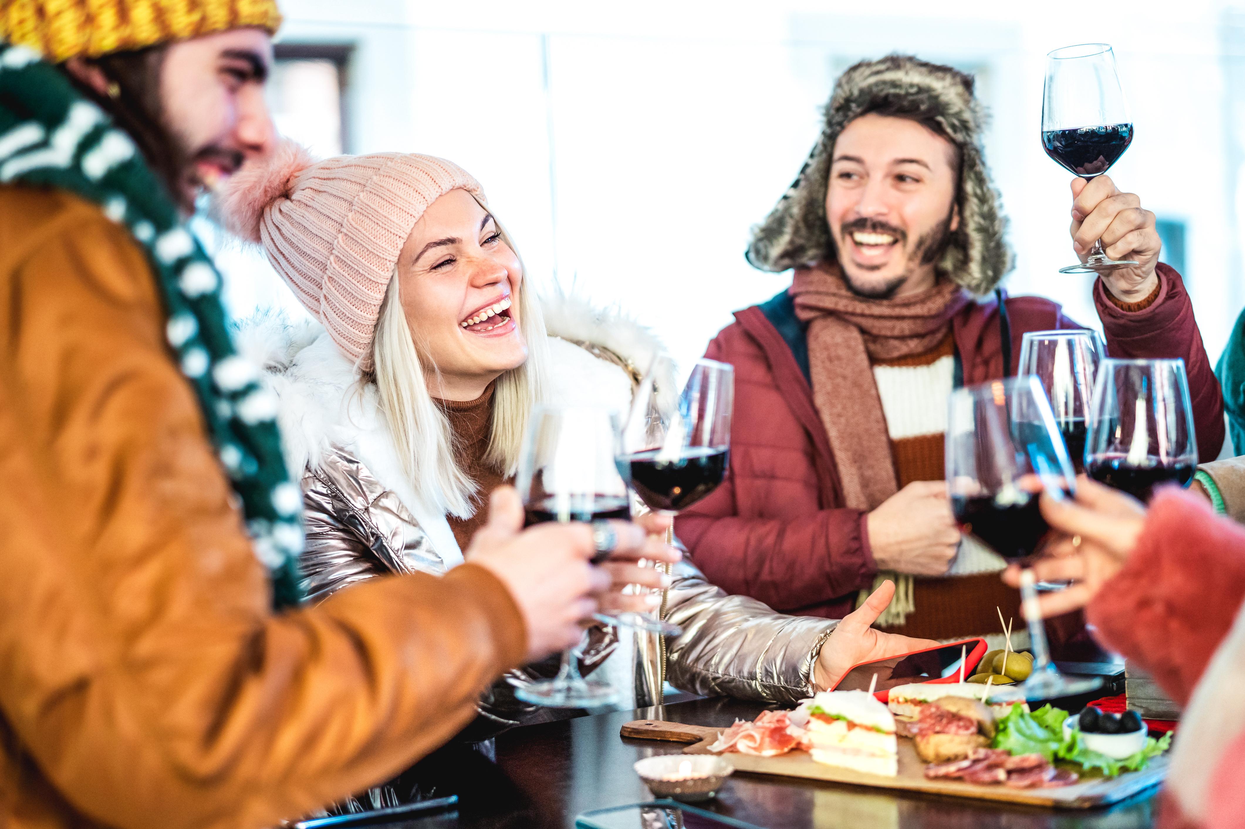 Winter people sipping wine