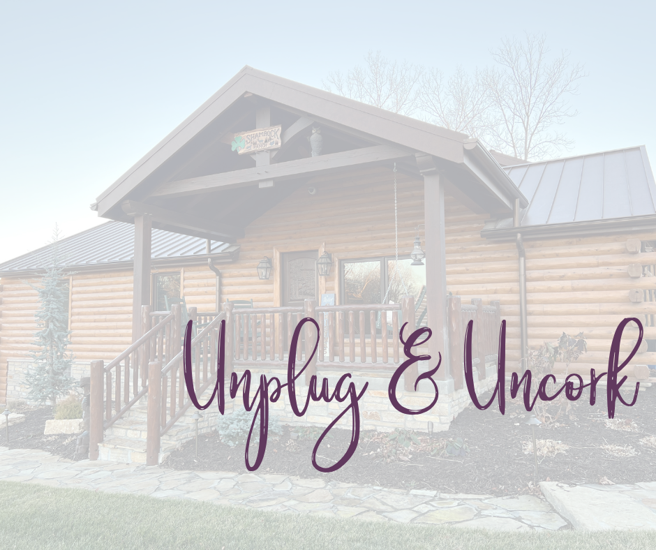 Cabin with an overlay that says unplug & uncork 