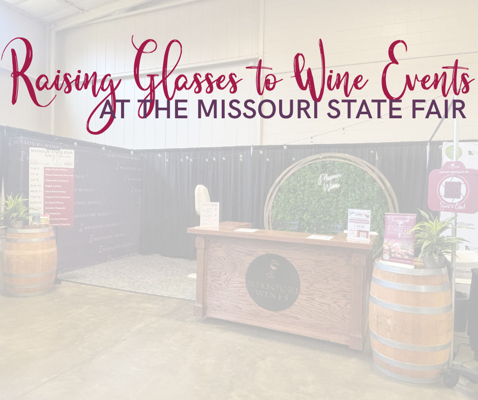 a missouri wine bar sitting in a booth with barrels and a backdrop of a greenery wall with words over the top reading rasiging glasses to wine events at the missouri state fair