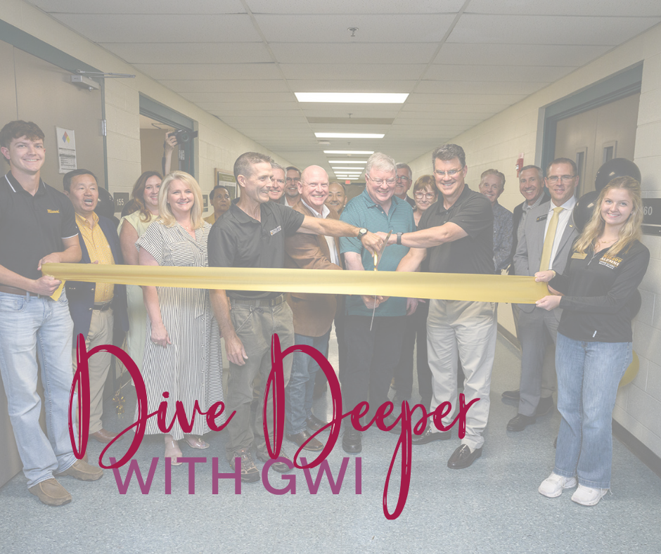 people standing and cutting a ribbon with the words dive deeper with GWI